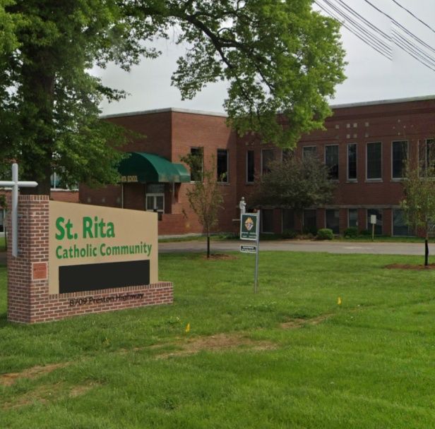 Front of our Saint Rita School and sign