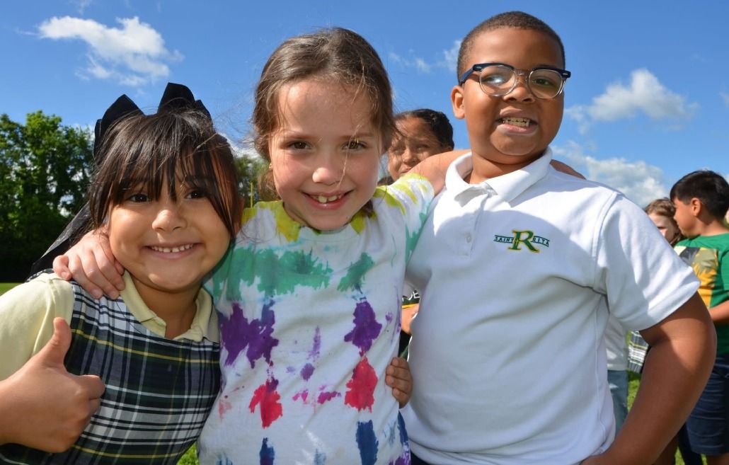 Three students together outside