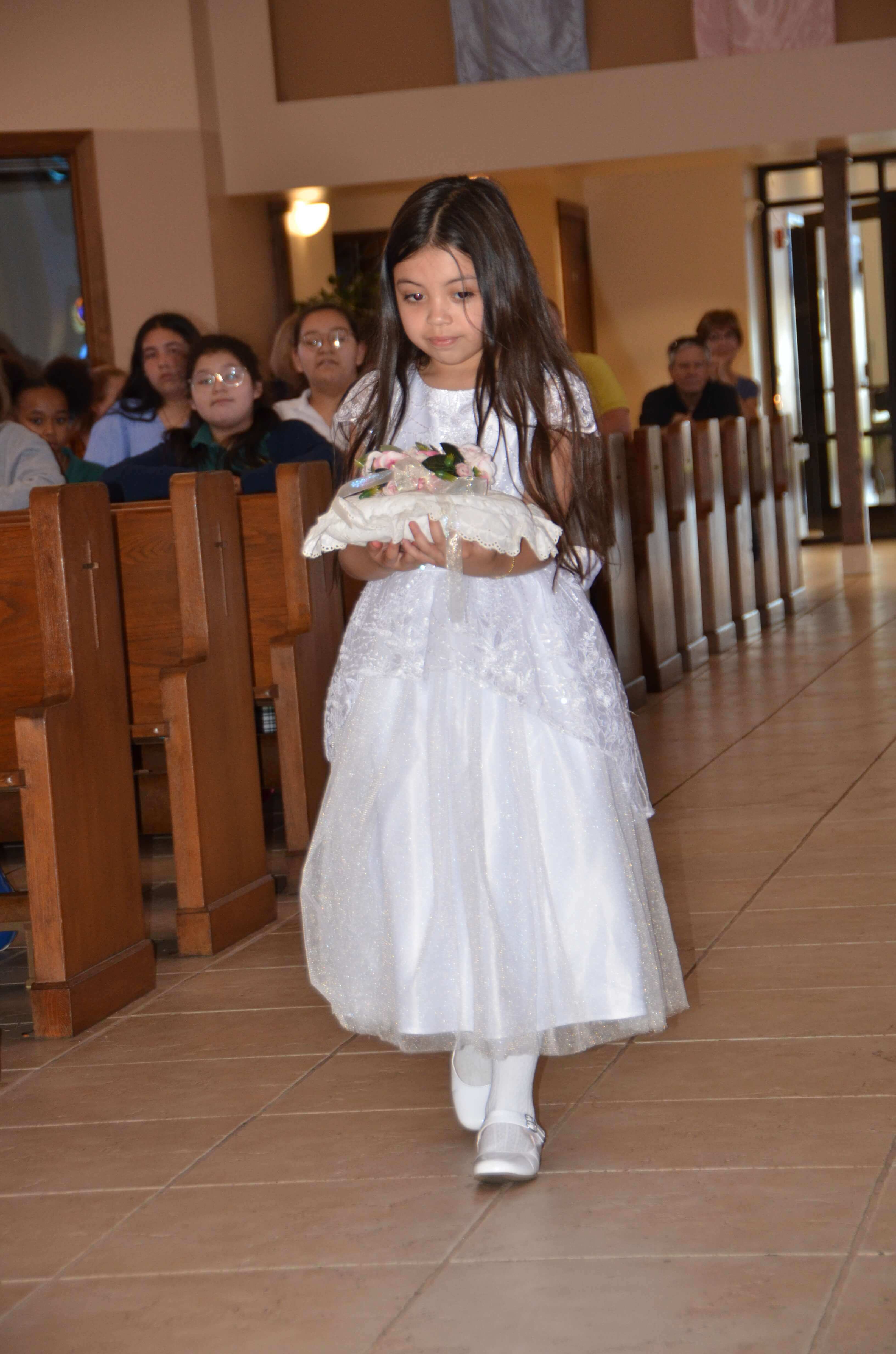 Child Carrying Flowers in Church