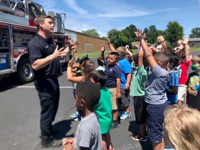 Students with firefighter